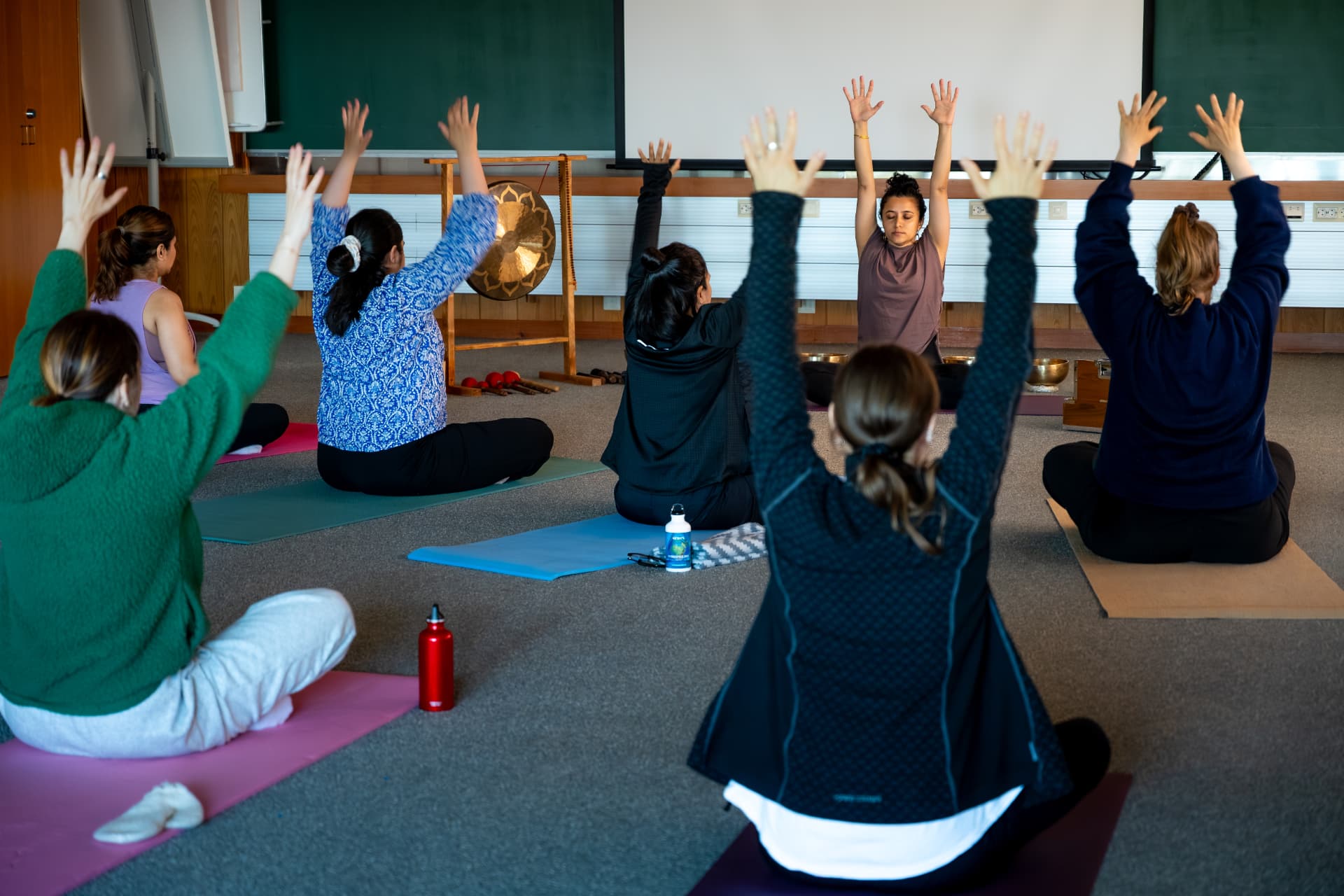 A group yoga retreat session with Uma leading the class
